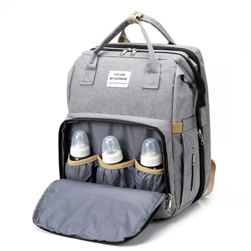 Zelara - 2in1 Baby Rucksack mit integriertem Wickelbett wählen