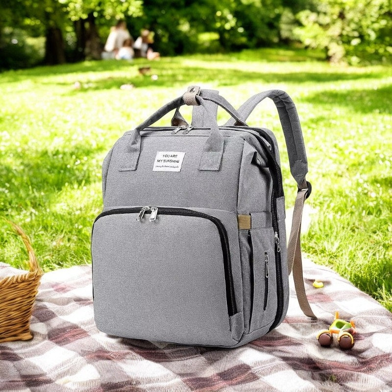 Multifunktionale Wickeltasche mit faltbarem Babybett und Wickelauflage